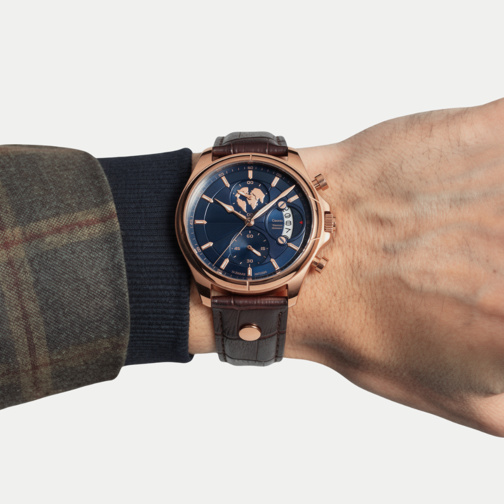 Breckmont Meridian rose gold men's dress watch on wrist blue dial brown leather strap